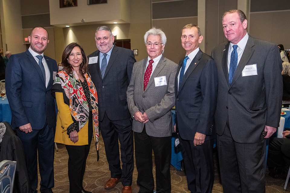 Attendees of the 2021 Bayer International Business Conference pose for a group photo during a networking reception with keynote speaker Christine Duffy, president of Carnival Cruise Line, and Hadi Alhor, Director of the Boeing Institute of International Business.