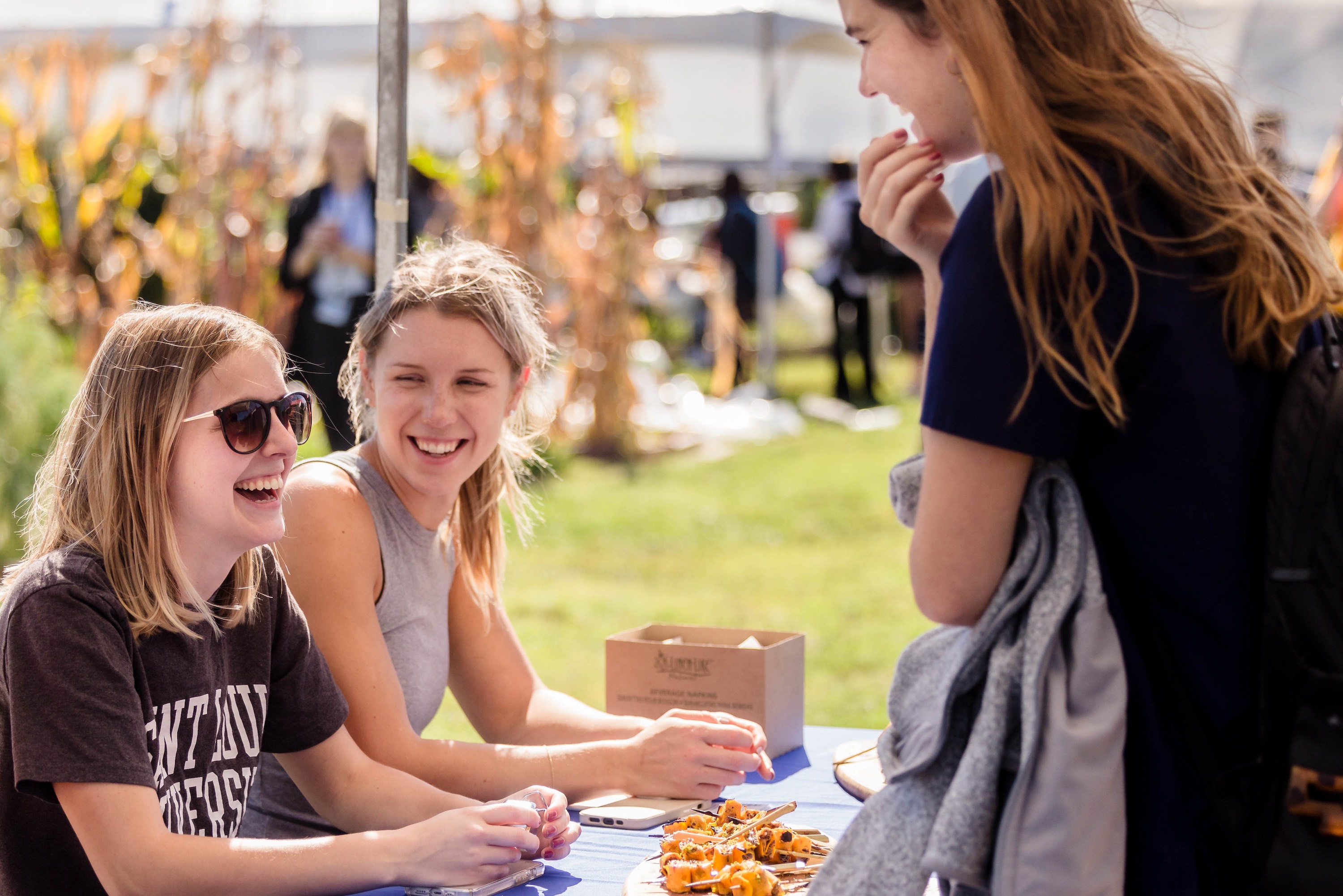 Students sitting an an FJAC table