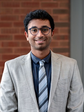 Young man in grey suit.