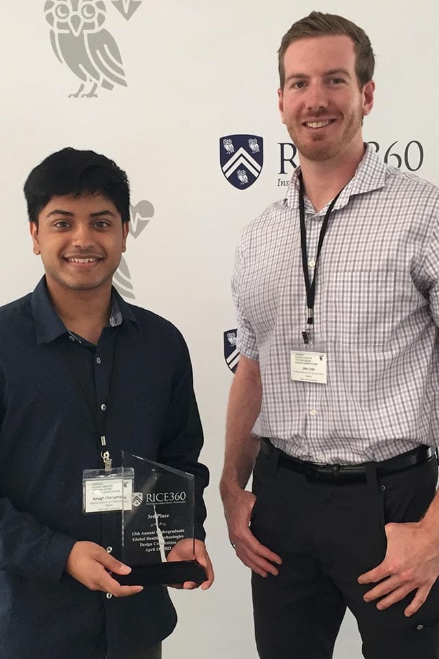 Amogh Chariyamane and Jake Little pose with their prize from the Annual Global Health Technologies Design Competition