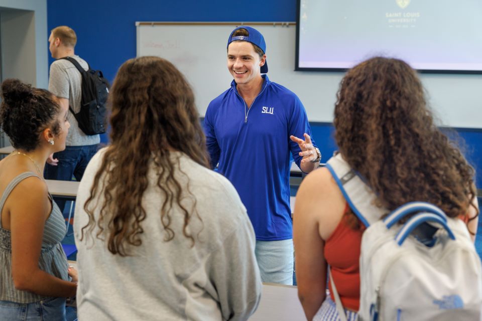 Joel Courtney in class with students 