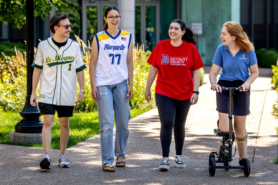 Student government leaders from Jesuit colleges and universities take a stroll on SLU's campus.